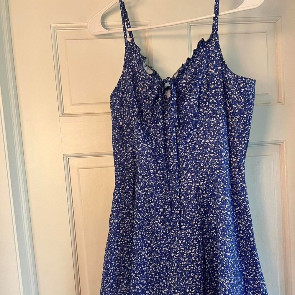 Blue floral romper with lace trim and tie front